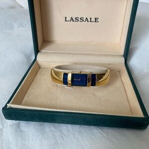 Lassale Ladies gold plated bangle watch with sapphire blue crystal inlay